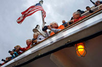 Juneau, Alaska, USA. American flag waving in Safari Endeavour. Passengers, tourists. Alaska USA. Icy Strait. Glacier Bay National Park adn Preserve. Chichagof Island. Juneau. Southeast Alaska. Today is the ultimate day of exploration. Set your course for arguably the richest whale waters in Southeast Alaska.