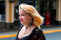 Juneau, Alaska, USA. Gothic young lady walking in Juneau, Alaska. USA. The City and Borough of Juneau is the capital city of Alaska. It is a unified municipality located on the Gastineau Channel in the Alaskan panhandle, and is the second largest city in the United States by area. Juneau has been the capital of Alaska since 1906, when the government of what was then the District of Alaska was moved from Sitka as dictated by the U.S. Congress in 1900. The municipality unified on July 1, 1970, when the city of Juneau merged with the city of Douglas and the surrounding Greater Juneau Borough to form the current home rule municipality. 