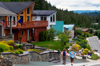 Juneau, Alaska, USA. Modern wooden houses in a residential suburb of Douglas area,  Juneau. ALASKA, USA.  The Douglas area of Juneau is located on Douglas Island and is linked to downtown Juneau by bridge. You'll find that a lot homes for sale in Douglas, AK have great views of the Downtown area, Mount Juneau, Mount Roberts and up and down the Gastineau Channel. 