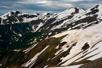 Juneau, Alaska, USA. Mount Roberts. Trekking from the Mt Roberts Tramway, Juneau. Alaska. The top terminal of the tram is located on a tower and offers spectacular views of the City of Juneau and the Gastineau Channel, Douglas Island and the community of Douglas to the west, the Chilkat Mountain Range to the north, and Kupreanof Island to the South. The terminal platform is joined to the ridge of Mount Roberts by the Skybridge which leads to the summit facilities. The main building includes the Timberline Bar & Grill, the Chilkat Theater showing an informative film of the local Alaska Natives, and Raven Eagle Gifts. Located at the main building is the Stephen Jackson totem pole, a modern rendition of traditional Native themes.