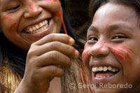 Yagua town. Some girls are painted with traditional paints.