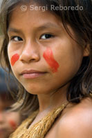 Yagua town. A traditionally painted teen poses for the camera.