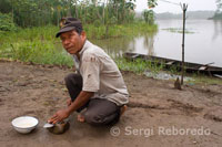 A coastal village of Timicuro I sharpen a knife outside his home.