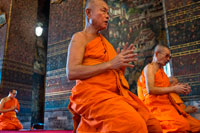 Bangkok. Buddhist Shrine Temple, Praying and Ordination Hall at Wat Pho, Bangkok, Thailand. Wat Pho (the Temple of the Reclining Buddha), or Wat Phra Chetuphon, is located behind the Temple of the Emerald Buddha and a must-do for any first-time visitor in Bangkok. It's one of the largest temple complexes in the city and famed for its giant reclining Buddha that measures 46 metres long and is covered in gold leaf. It’s an easy ten minute walk between here and the Grand Palace, and we recommend coming to Wat Pho second, because even though the golden Buddha here is just as popular many people don’t take the time to wander around the rest of the complex so the experience tends to be far more relaxing. 