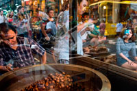 Bangkok. Roast chestnuts , Bangkok's Chinatown , Thailand. Market stall and street food being prepared in Chinatown Bangkok, Thailand. Yaowarat, Bangkok’s Chinatown, is the World’s most renowned street food destination and the local favorite dining district. On this early night adventure, we bring to you discover the sophisticated flavors of Bangkok’s 200 years old community that is rich with Thai-Chinese tradition & delicious food. During the tour you will walk to explore & taste local cuisines from 7 famous eateries, varied from street food vendors to renowned Thai-Chinese diners.