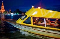 Bangkok. Chao Praya Express Boat at night. Bangkok, Public boat, ferry. Bangkok. Asia.  The Chao Phraya river makes a great way to get around, since many of the major tourist sites are easily accessible from the river. Chao Praya River Express operates a regular boat service up and down the river. Sort of a bus on the water. Fares are extremely cheap - you can get just about anywhere for 11 Baht to 25 Baht (0.34 USD to 0.76 USD) depending on the distance and the type of boat.