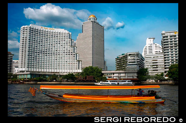 Chao Praya Express Boat Bangkok, Public boat, ferry. Bangkok. Asia.  Shangri La Hotel. The Chao Phraya river makes a great way to get around, since many of the major tourist sites are easily accessible from the river. Chao Praya River Express operates a regular boat service up and down the river. Sort of a bus on the water. Fares are extremely cheap - you can get just about anywhere for 11 Baht to 25 Baht (0.34 USD to 0.76 USD) depending on the distance and the type of boat. There are piers next to many of the riverside hotels. Even if you aren't staying on the river, if you are staying close to the elevated train system, you can catch a train to the Taksin Bridge station. A River Express pier is on the river right below the station, and there is generally someone on duty at the pier to sell you a ticket and help plan your trip. The boats can be dangerously crowded during peak traffic times, so avoid rush hours.. Chao Phraya Pier Guide. Bangkok Waterways. Interesting piers found along the 21km Chao Phraya River Express Boat route. Temples, a wet market or an unexpected enclave... if it's something worth seeing then it's here. Once you've decided which piers you want to visit, use the quick links below to familiarise yourself with the different ferry lines, namely their routes, schedules and fares. Then set off on your custom-made - and dirt cheap - adventure on the River of Kings. A quick tip: of the five lines that ply the water the Orange Flag is your best bet - it operates all day. After the morning rush-hour, boats come every 20 minutes until around 16:00 when other lines kick into action and boats appear more frequently. If completely confused by the melee, another more comfortable option is a 'Tourist Boat', though these only come every 30 minutes. Operating Hours: 06:00 - 19:30 Price: Typically between 10 to 15 baht, though long journeys at peak hours can reach 30 baht (fares paid onboard).