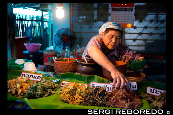 Woman seller. Food stall. Fish, vegetables, fast food. Ko Kret (also Koh Kred) is an island in the Chao Phraya River, 20 km north of Bangkok, Thailand. The island dates only to 1722, when a canal was constructed as a shortcut to bypass a bend in the Om Kret branch of the Chao Phraya river. As the canal was widened several times, the section cut off eventually became a separate island. The island continues to serve as a refuge to the Mon tribes who dominated central Thailand between the 6th and 10th centuries and have retained a distinct identity in their version of Buddhism and, particularly at Ko. One way to reach Ko Kret is to take the once-weekly Chao Phraya Express, which leaves the Central Pier (BTS Saphan Taksin) every Sunday at 09:00 and visits a number of attractions before returning at 15:30. The cost of the cruise and guided tour is 300 baht (no lunch). Many other companies also offer similar tours, often just as a stop on a longer upriver trip to Ayutthaya. Independent travel to Ko Kret can be a little more challenging. The easiest option is to take public bus 166 from Victory Monument which travels all the way to the market in Pak Kret. From there, you have to walk about 500 metres (or take a moto/samlor) towards the river to the ferry pier, which is located behind Wat Sanam Neua. If you exit the bus before the U-Turn simply continue towards the river. On the left you will see the entrance to a fairly inconspicuous market. Enter this then follow the market as long as you can (i.e. stay with the shops). Eventually you will come out near to the Wat and the route will be very obvious.