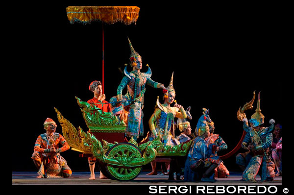 Thai classical dance performance at Salachalermkrung theater in Bangkok, Thailand. Khon-Thai Classical Masked Dance at the Sala Chalermkrung Royal Theatre On the Anspicious Occasion to the Throne, the Sala Chalermkrung Foundation, the Crown Property Bureau and the Tourism Authority of Thailand jointly organized the Khon-Thai Classical Masked Performance entitled 'Pra Chakrawatan' during December 2005 - july 2006 at the sala Chalermkrung Royal Theatre. The Sala Chalermkrung Royal Theatre now proundly present a new episode of Khon-Masked Dance entitled 'Hanuman Chankamhaeng', an excerpt from Ramakien story. This performance is also to celebrate the Auspicious Occasion of the 60th Anniversary Celebrations of His Majesty the King's Accession to the Throne. 'Hanuman' is a white monkey warrior, whose duty is to assist the righteous King 'Rama' to fight with the demon King 'Totsakan'. The 'Hanuman Chankamhaeng' performance depicts the life of Hanuman since he was born and became valiant soldier who helped king rama win againt Totsakan, and Hanuman was later promoted. This spectacular episode has 60 performers, with elaborate dress specially designed for this specific dance. It involves highly traditional singing, dancing, acting, acrobatics and music.