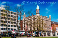 Robinson and Cleaver’s store from the Donegall Square. Robinson and Cleaver prided itself for being the most famous store in the world for Irish Linens. In 1921, it also advertised: We are making a Special Show of our New Season’s Models in all the latest shapes in Fur Coats, Wraps, Stoles and Collars in Skunk, Skunk Oppossum, Beaver, Beaver Coney and Real Moleskin. Animal Ties in White, Black, Grey, and Blue Foxes; also in Mongolian Fox and Blue Wolf. Only the most reliable quality of Furs are stocked.  In 1962, Robinson and Cleaver participated in the Belfast Chamber of Trade’s ‘Buy Ulster’ week, running an exhibition of Ulster goods. Despite extensive renovations in 1963, Robinson and Cleaver closed down in 1984 and its famous staircase was auctioned. Two years later, Next and Principles opened their first shops in Northern Ireland in Cleaver House. The rest of the building was let out for office space. The exterior was cleaned and renovated, and it remains a striking and well loved Belfast landmark.  