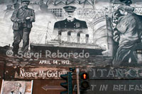 Titanic Wall Mural, Dee Street, Belfast This wall mural is on the corner of Netwownards Road and Dee Street. Dee Street led into the Harland and Wolff shipyard where RMS Titanic (and many other ships) were built - many of the shipyard workers who lived in this area would have walked up and down Dee Street on their way to and from work. The writing bottom right reads; 'This mural is respectfully dedicated to the men, women and children who lost their lives in the waters of the North Atlantic on the night of April 14th 1912: to those who survived - whose lives from that night on were forever altered and to those who built the Titanic "we forget them not" ' The writing botton laft (below the White Star flag) writes; RMS Titanic Her name is publicly announced April 1908. Designation begins on March 1909 On May 31st 1911, the Titanic was launched here in Belfast April 10th 1912 She left Southampton for New York April 14th 1912 Disaster struck in the North Atlantic ocean, 1523 people lost their lives in the disaster, 705 passengers and crew survived.' 