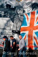 HMS "Belfast" mural, Belfast. A mural, at the Newtownards Road end of Tower Street, commemorating the building HMS “Belfast” Link by Harland & Wolff. Loyalist mural of HMS Belfast. Seen in East Belfast. HMS Belfast. HMS Belfast shows you what it was like to live and work on board a warship. Explore nine decks of amazing seafaring history where sailors once hurried up and down the ladders, and hear their battle stories from the Second World War and beyond - the convoys in icy Arctic conditions, the bombardment of German defences on D-Day and the 404 days spent patrolling waters during the Korean War. The Gun Turret Experience immerses you in the midst of a battle during the Second World War while the interactive Operations Room puts you in the Captain's shoes as you control a fleet of ships off North Borneo. You can also find out what it was like to live as part of a ship's community, eating, sleeping and socialising together in cramped messdecks. Down in the bowels of the ship, imagine what it was like to work among the noise and ferocity of the inner workings of the ship. 