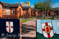 Sandy Row is a Protestant working-class community in south Belfast, Northern Ireland. It has a population of about 3,000.[citation needed] It is a staunchly loyalist area of Belfast, being a traditional heartland for affiliation with the paramilitary Ulster Defence Association (UDA) and the Orange Order. Sandy Row is situated in south Belfast, beginning at the edge of the city centre, close to the Europa Hotel. The road runs south from the Boyne Bridge (formerly the Saltwater Bridge) over the old Dublin railway line into Great Victoria Street station, then crosses the Donegall Road and on to the bottom of the Lisburn Road. At one end of the road was the famous Murray's tobacco factory, which first opened in 1810, while at the other is a large Orange hall. 