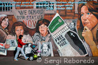 We Demand POW Status Now. "Forced to endure years of brutality, humiliatioon, degradation and torture, the prisoners embarked on hunger-strike, 27th October 1980". Falls Road Belfast, Northern Ireland International Wall, Falls Road, Belfast The subjects change with the exception of Guernica. LIkewise "Free Marian Price" has been added to all the paintings with the exception of Guernica. As one of the so-called "Price sisters", Price was jailed for her part in the IRA London bombing campaign of 1973. She was part of a unit who placed four car bombs in London on 8 March 1973. The Old Bailey (Central Criminal Court and Hillgate House – a Government Building) and Whitehall army recruitment centre were damaged with 200 injured and one man died of a heart attack. The two sisters were apprehended along with Hugh Feeney and seven others as they were boarding a flight to Ireland. They were tried and convicted at the Great Hall in Winchester Castle on 14 November after a two days of deliberation by the jury. Marian Price was sentenced to two life terms. She and her sister Dolours Price, along with Gerry Kelly and Hugh Feeney, immediately went on hunger strike in a campaign to be repatriated to a prison in Northern Ireland. The hunger strike lasted over 200 days, with the hunger strikers being force-fed by prison authorities for 167 of them. In an interview with Suzanne Breen, Marian described being force-fed: Four male prison officers tie you into the chair so tightly with sheets you can't struggle. You clench your teeth to try to keep your mouth closed but they push a metal spring device around your jaw to prise it open. They force a wooden clamp with a hole in the middle into your mouth. Then, they insert a big rubber tube down that. They hold your head back. You can't move. They throw whatever they like into the food mixer – orange juice, soup, or cartons of cream if they want to beef up the calories. They take jugs of this gruel from the food mixer and pour it into a funnel attached to the tube. The force-feeding takes 15 minutes but it feels like forever. You're in control of nothing. You're terrified the food will go down the wrong way and you won't be able to let them know because you can't speak or move. You're frightened you'll choke to death. 