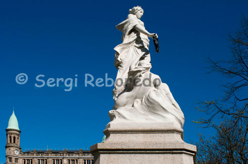 The Titanic Memorial in Belfast was erected to commemorate the lives lost in the sinking of the RMS Titanic on 15 April 1912. It was funded by contributions from the public, shipyard workers and victims' families, and was dedicated in June 1920. It is located on Donegall Square in central Belfast in the grounds of Belfast City Hall. The memorial presents an allegorical representation of the disaster in the form of a female personification of Death or Fate holding a laurel wreath over the head of a drowned sailor raised above the waves by a pair of mermaids. It has been used as the site of annual commemorations of the Titanic disaster. For a while it was obscured by the Belfast Wheel that was removed in April 2010. It is now the centrepiece of a small Titanic memorial garden that was opened on 15 April 2012, the centenary of the disaster. Together with the garden, it is the only memorial in the world to commemorate all of the victims of the Titanic, passengers and crew alike.