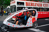 Turistic bus and Tourist Bicycle in Berlin, Germany. Berliner City Bus. If you decided to visit Berlin, a bike tour is the best way to get to know the city along with its beautiful sights and history.