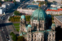 Berlin Cathedral, aerial landscape viewed from the TV tower, Berlin. The Berliner Dom (Berlin Cathedral), completed in 1905, is Berlin’s largest and most important Protestant church as well as the sepulchre of the Prussian Hohenzollern dynasty. This outstanding high-renaissance baroque monument has linked the Hohenzollerns to German Protestantism for centuries and undergone renewed phases of architectural renovation since the Middle Ages. First built in 1465 as a parish church on the Spree River it was only finally completed in 1905 under the last German Kaiser -Wilhelm II. Damaged during the Second World War it remained closed during the GDR years and reopened after restoration in 1993.