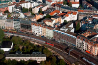 Berlin Panorama from the Fernsehturm with the shadow of the tower, Berlin, Germany. Diferents trains. View across Berlin from the observation deck of the Fernsehturm TV Tower in East Berlin. Buildings and trains. Close to Alexanderplatz in Mitte, the tower was constructed between 1965 and 1969 by the administration of the German Democratic Republic. It was intended as a symbol of Berlin, which it remains today, as it is easily visible throughout the central and some suburban districts of Berlin. With its height of 368 meters, it is the tallest structure in Germany.