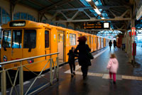 Berlin. Germany. Ubahn Station at Schlesisches Tor, Kreuzberg, Berlin. Railway station Berlin Warschauer Strafle station Berlin Germany. Warschauer Strasse Oberbaumcity street light lights lamp lamps lamppost transport underground train trains subway subways line lines underground station stations tube geography Europe western europe central europe Germany Eastern Germany Berlin capital city Friedrichshain person background people people in the background city view cityscape cityscapes city views street scene urban scene urban townscape street scenes day building exterior exterior exterior view external outdoor outside outdoor shots outdoor shot outdoors horizontal horizontal format color coloured colored colors colours photograph photo images image photographs photos public transport public local traffic Lampposts railcar railcars train station continent continents Europa FRG human humans people persons days dayshot dayshots colour. 