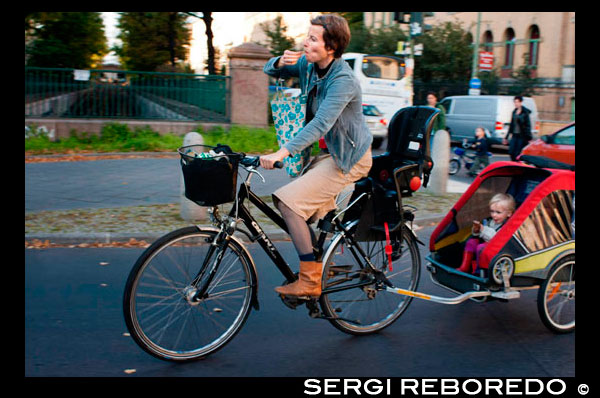 A mother carries her child bicycle through the streets of Prenzlauer Berg. Prenzlauer Berg is a locality of Berlin, forming the southern part of the borough of Pankow. Until 2001, Prenzlauer Berg was itself a borough of Berlin; in that year it was merged (together with the former borough Weißensee) into the borough of Pankow. After German reunification in 1990 Prenzlauer Berg became a centre for more bohemian Berlin youth, while more recently it has experienced gentrification. Prenzlauer Berg is a portion of the Pankow district in northeast Berlin. On the west and southwest it borders Mitte, on the south Friedrichshain-Kreuzberg, on the east Lichtenberg, and on the north Weißensee and Pankow. Geologically, the district lies entirely on the Barnim glacial deposit and borders from the southwest (to Mitte) on the Berlin glacier valley, which was formed in the Ice Age. The highest point of the district is 91 meters above sea level in the northwest of Volkspark Prenzlauer Berg. This hill came into being after World War II, created from one of the debris piles after the gathering of rubble from the city center and the subsequent rebuilding.