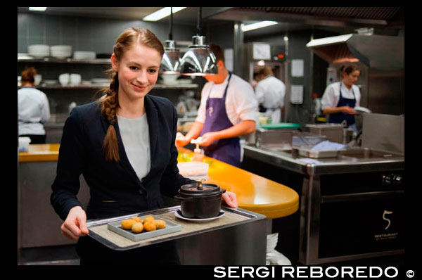 Kitchen of Das Stuen. Michelin-starred Catalan chef Paco Pérez in Das Stue Restaurant. Occupying a 1930s building that originally was Berlin's Royal Danish Embassy, Das Stue's unique heritage is reflected in its name, the Danish term for "living room." The hotel incorporates the prominence of its classicist facade and the natural beauty of its leafy Tiergarten address, formerly the city's royal hunting grounds. The owners have created a sophisticated urban retreat with personalized comforts – much like the living room of someone who is well connected in Berlin and has immediate access to the city's countless attractions. Patricia Urquiola, the acclaimed Spanish architect and designer, brings her signature sleek and elegant touch to the hotel’s interiors. Michelin-starred Catalan chef Paco Pérez helms Das Stue’s food concept, serving avant-garde Mediterranean cuisine combined with local accents. Sincere, honest, flavor-driven, creative, surprising….: that just about sums up Paco Pérez’s style of cooking. Backed up by his tenet that “everyone should do what he knows in his heart he really ought to be doing, and not deny his principles”, it has earned him five Michelin stars: two for the Miramar, his trademark restaurant in Llançá (Girona, eastern Spain), two for the Enoteca, located within the Hotel Arts in Barcelona and one in his venue in Berlin. His laid-back manner belies a packed schedule, which also includes running the restaurant of the Hotel Mirror, again in Barcelona.  The tramontana strikes again. I seem to be doomed. It’s enough for me to go anywhere near the Ampurdan coast for this dismal north wind to start blowing. My visit to the Hotel Restaurante Miramar in Llançá (Girona, eastern Spain) is no exception. I’m here to discover the key features of the Paco Pérez approach to cooking, but the tramontana is no respecter of such missions, and the bout of bad weather that this unpleasant inland wind typically carries along with it is stirring up the waters of this stretch of the Mediterranean.  Against this backdrop, Paco Pérez’s affability beams out in contrast. A ‘self-made’ chef with a low-key approach to life, he avoids the circuit of media events, conferences, and hoo-ha generally. We sit on the covered terrace of his restaurant looking out over the sea, and chat about his (nearly) twenty years at the helm of a gastronomic enterprise (running the Miramar, and acting as advisor to two restaurants-within-hotels in Barcelona – Enoteca in the Arts, and the Mirror) that has earned him three Michelin stars, two for the Miramar and one for Enoteca.  Paco not only directs the teams; he cooks, too. ”I’m a cook. I cook every day”, he says. His passionate interest in food and cooking dates back to early childhood; while still at primary school he used to love slipping into the kitchen to watch what was going on and then try to imitate what he saw. Later, his pursuit of what was clearly a vocation began withtaking a job in a little tapas bar owned by his family, starting off as a waiter and then graduating to the kitchen: “That experience of dealing with the public was key. Being in direct contact with the customers means that you can observe how they react to various tastes and smells - vital information that doesn’t reach you when you’re behind the scenes in the kitchen”.  His schooldays over, he set about becoming a member of the food world, spending several training periods in France on placements with Michel Guérard (one of the progenitors of Nouvelle Cuisine) until he was called up to do his (then obligatory) military service back in Spain. This was when Montse appeared on the scene, turning what would have been just a temporary interruption into a permanent one. “While I was doing the mili in Madrid , a friend told me that his parents, who ran a little hostal (boarding house) near the beach in Llançà, needed help over the Easter period. I decided to give them a hand and spend my holidays there”.  And there he stayed. The original plan return to France to continue his training dissolved in the face of his desire to remain with Montse, sister of the friend who had introduced him to the Miramar, for whom he had fallen in a big way. However, he continued studying and acquiring skills and know-how, and soon after made contact with Ferrán Adriá . Indeed, it was at elBulli that he came to understand the nature of his attitude to cooking, “….an approach to food that involves the senses – you take in the look of it, the smell, the feel, then you eat it, taste it, experience the pleasure of it and retain it in your memory”. Many have described his style of cooking as ‘elBulliesque’, which he takes as a compliment: “To me, cooking in the style of elBulli involves being consistent, creative, humble and hard-working, so I’m delighted if it’s true”. 