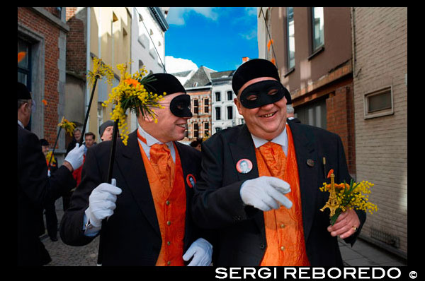 Music, dance, party and costumes in Binche Carnival. Ancient and representative cultural event of Wallonia, Belgium. The carnival of Binche is an event that takes place each year in the Belgian town of Binche during the Sunday, Monday, and Tuesday preceding Ash Wednesday. The carnival is the best known of several that take place in Belgium at the same time and has been proclaimed as a Masterpiece of the Oral and Intangible Heritage of Humanity listed by UNESCO. Its history dates back to approximately the 14th century. Events related to the carnival begin up to seven weeks prior to the primary celebrations. Street performances and public displays traditionally occur on the Sundays approaching Ash Wednesday, consisting of prescribed musical acts, dancing, and marching. Large numbers of Binche's inhabitants spend the Sunday directly prior to Ash Wednesday in costume. The centrepiece of the carnival's proceedings are clown-like performers known as Gilles. Appearing, for the most part, on Shrove Tuesday, the Gilles are characterised by their vibrant dress, wax masks and wooden footwear. They number up to 1,000 at any given time, range in age from 3 to 60 years old, and are customarily male. The honour of being a Gille at the carnival is something that is aspired to by local men