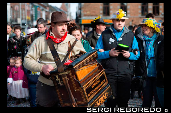 Music, dance, party and costumes in Binche Carnival. Ancient and representative cultural event of Wallonia, Belgium. The carnival of Binche is an event that takes place each year in the Belgian town of Binche during the Sunday, Monday, and Tuesday preceding Ash Wednesday. The carnival is the best known of several that take place in Belgium at the same time and has been proclaimed as a Masterpiece of the Oral and Intangible Heritage of Humanity listed by UNESCO. Its history dates back to approximately the 14th century. Events related to the carnival begin up to seven weeks prior to the primary celebrations. Street performances and public displays traditionally occur on the Sundays approaching Ash Wednesday, consisting of prescribed musical acts, dancing, and marching. Large numbers of Binche's inhabitants spend the Sunday directly prior to Ash Wednesday in costume. The centrepiece of the carnival's proceedings are clown-like performers known as Gilles. Appearing, for the most part, on Shrove Tuesday, the Gilles are characterised by their vibrant dress, wax masks and wooden footwear. They number up to 1,000 at any given time, range in age from 3 to 60 years old, and are customarily male. The honour of being a Gille at the carnival is something that is aspired to by local men