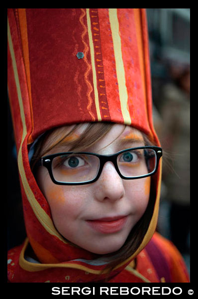 Girl dressed with costume. Children and teenagers dressed with costumes. Music, dance, party and costumes in Binche Carnival. Ancient and representative cultural event of Wallonia, Belgium. The carnival of Binche is an event that takes place each year in the Belgian town of Binche during the Sunday, Monday, and Tuesday preceding Ash Wednesday. The carnival is the best known of several that take place in Belgium at the same time and has been proclaimed as a Masterpiece of the Oral and Intangible Heritage of Humanity listed by UNESCO. Its history dates back to approximately the 14th century. Events related to the carnival begin up to seven weeks prior to the primary celebrations. Street performances and public displays traditionally occur on the Sundays approaching Ash Wednesday, consisting of prescribed musical acts, dancing, and marching. Large numbers of Binche's inhabitants spend the Sunday directly prior to Ash Wednesday in costume. The centrepiece of the carnival's proceedings are clown-like performers known as Gilles. Appearing, for the most part, on Shrove Tuesday, the Gilles are characterised by their vibrant dress, wax masks and wooden footwear. They number up to 1,000 at any given time, range in age from 3 to 60 years old, and are customarily male. The honour of being a Gille at the carnival is something that is aspired to by local men