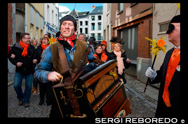 Music, dance, party and costumes in Binche Carnival. Ancient and representative cultural event of Wallonia, Belgium. The carnival of Binche is an event that takes place each year in the Belgian town of Binche during the Sunday, Monday, and Tuesday preceding Ash Wednesday. The carnival is the best known of several that take place in Belgium at the same time and has been proclaimed as a Masterpiece of the Oral and Intangible Heritage of Humanity listed by UNESCO. Its history dates back to approximately the 14th century. Events related to the carnival begin up to seven weeks prior to the primary celebrations. Street performances and public displays traditionally occur on the Sundays approaching Ash Wednesday, consisting of prescribed musical acts, dancing, and marching. Large numbers of Binche's inhabitants spend the Sunday directly prior to Ash Wednesday in costume. The centrepiece of the carnival's proceedings are clown-like performers known as Gilles. Appearing, for the most part, on Shrove Tuesday, the Gilles are characterised by their vibrant dress, wax masks and wooden footwear. They number up to 1,000 at any given time, range in age from 3 to 60 years old, and are customarily male. The honour of being a Gille at the carnival is something that is aspired to by local men