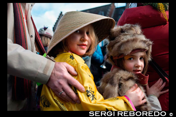Music, dance, party and costumes in Binche Carnival. Ancient and representative cultural event of Wallonia, Belgium. The carnival of Binche is an event that takes place each year in the Belgian town of Binche during the Sunday, Monday, and Tuesday preceding Ash Wednesday. The carnival is the best known of several that take place in Belgium at the same time and has been proclaimed as a Masterpiece of the Oral and Intangible Heritage of Humanity listed by UNESCO. Its history dates back to approximately the 14th century. Events related to the carnival begin up to seven weeks prior to the primary celebrations. Street performances and public displays traditionally occur on the Sundays approaching Ash Wednesday, consisting of prescribed musical acts, dancing, and marching. Large numbers of Binche's inhabitants spend the Sunday directly prior to Ash Wednesday in costume. The centrepiece of the carnival's proceedings are clown-like performers known as Gilles. Appearing, for the most part, on Shrove Tuesday, the Gilles are characterised by their vibrant dress, wax masks and wooden footwear. They number up to 1,000 at any given time, range in age from 3 to 60 years old, and are customarily male. The honour of being a Gille at the carnival is something that is aspired to by local men