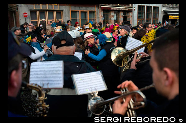 Music, dance, party and costumes in Binche Carnival. Ancient and representative cultural event of Wallonia, Belgium. The carnival of Binche is an event that takes place each year in the Belgian town of Binche during the Sunday, Monday, and Tuesday preceding Ash Wednesday. The carnival is the best known of several that take place in Belgium at the same time and has been proclaimed as a Masterpiece of the Oral and Intangible Heritage of Humanity listed by UNESCO. Its history dates back to approximately the 14th century. Events related to the carnival begin up to seven weeks prior to the primary celebrations. Street performances and public displays traditionally occur on the Sundays approaching Ash Wednesday, consisting of prescribed musical acts, dancing, and marching. Large numbers of Binche's inhabitants spend the Sunday directly prior to Ash Wednesday in costume. The centrepiece of the carnival's proceedings are clown-like performers known as Gilles. Appearing, for the most part, on Shrove Tuesday, the Gilles are characterised by their vibrant dress, wax masks and wooden footwear. They number up to 1,000 at any given time, range in age from 3 to 60 years old, and are customarily male. The honour of being a Gille at the carnival is something that is aspired to by local men