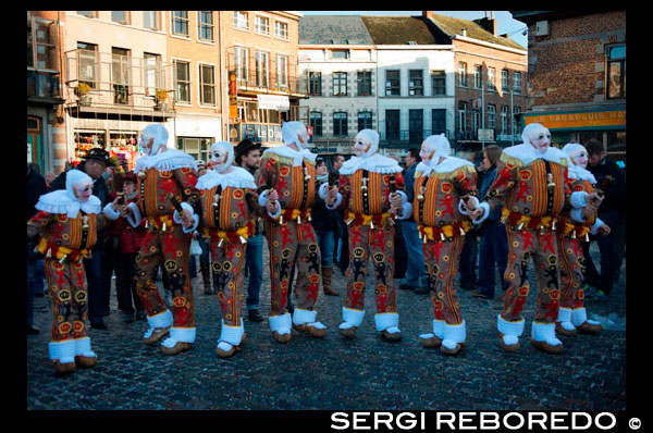 Belgium, carnaval of Binche. UNESCO World Heritage Parade Festival. Belgium, Walloon Municipality, province of Hainaut, village of Binche. The carnival of Binche is an event that takes place each year in the Belgian town of Binche during the Sunday, Monday, and Tuesday preceding Ash Wednesday. The carnival is the best known of several that take place in Belgium at the same time and has been proclaimed as a Masterpiece of the Oral and Intangible Heritage of Humanity listed by UNESCO. Its history dates back to approximately the 14th century. Events related to the carnival begin up to seven weeks prior to the primary celebrations. Street performances and public displays traditionally occur on the Sundays approaching Ash Wednesday, consisting of prescribed musical acts, dancing, and marching. Large numbers of Binche's inhabitants spend the Sunday directly prior to Ash Wednesday in costume. The centrepiece of the carnival's proceedings are clown-like performers known as Gilles. Appearing, for the most part, on Shrove Tuesday, the Gilles are characterised by their vibrant dress, wax masks and wooden footwear. They number up to 1,000 at any given time, range in age from 3 to 60 years old, and are customarily male. The honour of being a Gille at the carnival is something that is aspired to by local men