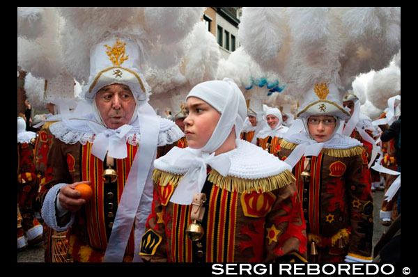 Belgium, carnaval of Binche. UNESCO World Heritage Parade Festival. Belgium, Walloon Municipality, province of Hainaut, village of Binche. The carnival of Binche is an event that takes place each year in the Belgian town of Binche during the Sunday, Monday, and Tuesday preceding Ash Wednesday. The carnival is the best known of several that take place in Belgium at the same time and has been proclaimed as a Masterpiece of the Oral and Intangible Heritage of Humanity listed by UNESCO. Its history dates back to approximately the 14th century. Events related to the carnival begin up to seven weeks prior to the primary celebrations. Street performances and public displays traditionally occur on the Sundays approaching Ash Wednesday, consisting of prescribed musical acts, dancing, and marching. Large numbers of Binche's inhabitants spend the Sunday directly prior to Ash Wednesday in costume. The centrepiece of the carnival's proceedings are clown-like performers known as Gilles. Appearing, for the most part, on Shrove Tuesday, the Gilles are characterised by their vibrant dress, wax masks and wooden footwear. They number up to 1,000 at any given time, range in age from 3 to 60 years old, and are customarily male. The honour of being a Gille at the carnival is something that is aspired to by local men