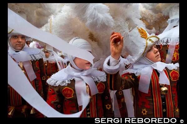 Belgium, carnaval of Binche. UNESCO World Heritage Parade Festival. Belgium, Walloon Municipality, province of Hainaut, village of Binche. The carnival of Binche is an event that takes place each year in the Belgian town of Binche during the Sunday, Monday, and Tuesday preceding Ash Wednesday. The carnival is the best known of several that take place in Belgium at the same time and has been proclaimed as a Masterpiece of the Oral and Intangible Heritage of Humanity listed by UNESCO. Its history dates back to approximately the 14th century. Events related to the carnival begin up to seven weeks prior to the primary celebrations. Street performances and public displays traditionally occur on the Sundays approaching Ash Wednesday, consisting of prescribed musical acts, dancing, and marching. Large numbers of Binche's inhabitants spend the Sunday directly prior to Ash Wednesday in costume. The centrepiece of the carnival's proceedings are clown-like performers known as Gilles. Appearing, for the most part, on Shrove Tuesday, the Gilles are characterised by their vibrant dress, wax masks and wooden footwear. They number up to 1,000 at any given time, range in age from 3 to 60 years old, and are customarily male. The honour of being a Gille at the carnival is something that is aspired to by local men