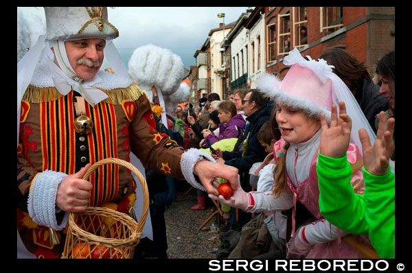 Belgium, carnaval of Binche. UNESCO World Heritage Parade Festival. Belgium, Walloon Municipality, province of Hainaut, village of Binche. The carnival of Binche is an event that takes place each year in the Belgian town of Binche during the Sunday, Monday, and Tuesday preceding Ash Wednesday. The carnival is the best known of several that take place in Belgium at the same time and has been proclaimed as a Masterpiece of the Oral and Intangible Heritage of Humanity listed by UNESCO. Its history dates back to approximately the 14th century. Events related to the carnival begin up to seven weeks prior to the primary celebrations. Street performances and public displays traditionally occur on the Sundays approaching Ash Wednesday, consisting of prescribed musical acts, dancing, and marching. Large numbers of Binche's inhabitants spend the Sunday directly prior to Ash Wednesday in costume. The centrepiece of the carnival's proceedings are clown-like performers known as Gilles. Appearing, for the most part, on Shrove Tuesday, the Gilles are characterised by their vibrant dress, wax masks and wooden footwear. They number up to 1,000 at any given time, range in age from 3 to 60 years old, and are customarily male. The honour of being a Gille at the carnival is something that is aspired to by local men