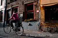 Bruges, Belgium via bike. It has been many years since I first visited Bruges, Belgium, but one image stays strong in my memory – bicycles. They are everywhere in this tiny town, about 50 miles northwest from Brussels, and are definitely the recommended mode of transportation while visiting. As you arrive in the train station, you will find the first opportunity to rent bikes, in the station, for 6,50 Euros for half a day, 9,50 Euros for a full day. The bikes must be returned before 7:30pm, and you are required to leave a deposit. If you prefer a guided tour, by bicycle of Bruges, Toerisme Brugge lists several bike tour companies, including Pink Bear Bike Tours, which arranges leisurely rides to nearby Damme via a tree-lined canal. Many photo opportunities abound, with picturesque windmills and Flemish villages. And if you are interested in exploring the country of Belgium via bike, it is good to know that bikes can be taken on trains, although you will need a special bike + train ticket. In addition, you are advised to travel off-peak with your bike, and follow the train conductors as to where to load and unload your bike.