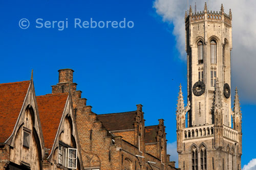 BRUGES : The Belfry and the Cloth Hall. The entire complex still bears witness to the importance of Bruges as a medieval trade center. In the cloth hall, the Flemish cloth which was manufactured in different other cities was sold to the rest of the world. In 1399, for instance, there were 384 sales stands inside the hall. Nowadays, the belfry tower charms the visitor with the lovely music of a carillion, which consists of 47 bells. Other more recent decorations are the sculpture of the Madonna in renaissance style and the weapon with a Belgian lion.