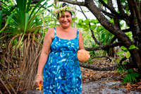 Aitutaki. Cook Island. Polynesia. South Pacific Ocean. In a makeshift beachside restaurant delights are prepared with coconut flavor.  Maina is one of 22 islands in the Aitutaki atoll of the Cook Islands. It is located at the southwestern extreme of Aitutaki Lagoon, five kilometres to the southwest of the main island of Aitutaki. In front of Maina island stands the beautiful sandbar known as "Honeymoon Island" named after a Canadian couple who decided to get married here.The sand is incredibly white and the water is transparent blue. The sandbar is also home (for a few months a year) of a rare single red feather bird who comes on the island to lay eggs. Aitutaki island is a combination of high island and coral atoll formed from a volcanic eruption on the sea bed, 5 kilometres below the surface of the South Pacific ocean. It is a similar type to Bora Bora in French Polynesia. After Aitutaki rose above the ocean surface, coral formed on the shores of this "high island" (Like Rarotonga is today).  Weathering eroded much of the basalt rock but the reef kept building vertically from it's original position, leaving the Aitutaki lagoon between the reef and the remaining basaltic parts of the main island of Aitutaki. The islets of Motu Rapota and Motu Rakau which lie inside the Aitutaki lagoon are blow holes from the main volcano – Maungapu - and lava tunnels run from this mountain underneath the lagoon to those small islands.