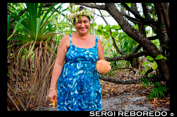 Aitutaki. Cook Island. Polynesia. South Pacific Ocean. In a makeshift beachside restaurant delights are prepared with coconut flavor.  Maina is one of 22 islands in the Aitutaki atoll of the Cook Islands. It is located at the southwestern extreme of Aitutaki Lagoon, five kilometres to the southwest of the main island of Aitutaki. In front of Maina island stands the beautiful sandbar known as "Honeymoon Island" named after a Canadian couple who decided to get married here.The sand is incredibly white and the water is transparent blue. The sandbar is also home (for a few months a year) of a rare single red feather bird who comes on the island to lay eggs. Aitutaki island is a combination of high island and coral atoll formed from a volcanic eruption on the sea bed, 5 kilometres below the surface of the South Pacific ocean. It is a similar type to Bora Bora in French Polynesia. After Aitutaki rose above the ocean surface, coral formed on the shores of this "high island" (Like Rarotonga is today).  Weathering eroded much of the basalt rock but the reef kept building vertically from it's original position, leaving the Aitutaki lagoon between the reef and the remaining basaltic parts of the main island of Aitutaki. The islets of Motu Rapota and Motu Rakau which lie inside the Aitutaki lagoon are blow holes from the main volcano – Maungapu - and lava tunnels run from this mountain underneath the lagoon to those small islands.