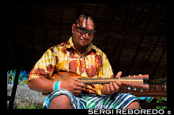 Aitutaki. Cook Island. Polynesia. South Pacific Ocean. Playing the ukulele (typical Polynesian guitar) in Aitutaki Punani Culture Tours. Tahitian ukulele. Ideally, the best way to learn the uke is to spend a bit of time in Tahiti, The Cook Islands, Rapa nui, Marquesas, Niue or Aotearoa(NZ) and just jam with the locals. Like all music in the pacific, the uke is generally learnt from a young age and gradually picked up over time from family or friends. Polynesian music is also learnt and played by ear, so when someone starts singing or playing a song you just listen for the key and join in. If you can play a Hawaiian uke then you should be able to pick up the Tahitian uke a lot faster as the chord patterns are basically the same. The main difference is the lead work and strumming techniques/patterns which take a bit of time to master. Koata from Kanua ukuleles has a series of excellent instructional videos (See below) to get you started.  Strumming: One of the hardest things about playing island ukes is the fast strum. On a guitar or Hawaiian uke, it's usually done flamenco style using all the fingers but with the Island style uke we just use a pick. The first thing you need to do is practice getting a rapid strum action by pivoting from the wrist. Once you get a clear and even vibrating sound going, you can then start creating funkier rhythms by flicking the wrist a bit harder on the particular down strum you want to stress. For example, you can emphasize every 5th or 7th down strum (although its actually hard to count the exact number because this stum is so fast!). It's the down strums which accentuate the particular rhythm you want. The more advanced stumming rhythms are sometimes similar to Rutu Pa'u (Cook Island drumming) and especially patterns played on the Pate (lead rhythm drum). It takes a while (sometimes years) to get the rapid strum rhythms wired, so just keep at it!