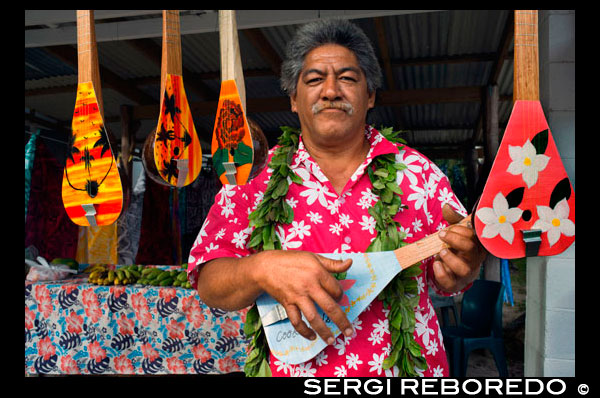 Rarotonga Island. Cook Island. Polynesia. South Pacific Ocean. Typical Ukulele Tahitian Polynesian guitar shop. The Ukulele (meaning ‘jumping flea’ in Hawai’ian) is believed to have travelled from Hawaii via Tahiti in the late 1800′s. The preferred ukulele in the Cook Islands today are banjo-shaped or oblong, which came into vogue in the Cook Islands about 1995, after Te Ava Piti, a popular Tahitian band, aired them in a music video. Ukuleles are always used in tandem with guitars during performances. Traditional dance is the most prominent art form of the Cook Islands. Each island has its own unique dances that are taught to all children. Christian music is extremely popular in the Cook Islands. There is much variation of Christian music across the region, and each island has its own traditional songs. Tahitian ukes are a pretty rare instrument so its hard to find places(outside the pacific) where you can buy or listen to them. Below are a few websites where you can purchase ukes and uke music online. You can pick up strings at your local fishing shop. Anything from 10kg-30kg guage line will do the damage, depending on what kind of uke, sound and playing you're into. The best place to see live ukes in action are at traditional arts and culture festivals (see links). Local street markets around the pacific are also good places to find ukes for sale along with plenty of cheap local food, clothes, arts and crafts and free entertainment. Heres just a few - Cook Islands: Punanga Nui markets in Avarua(Rarotonga). Aotearoa(NZ): Avondale, Otara, Mangere and Porirua markets. Tahiti: Papeete market.  