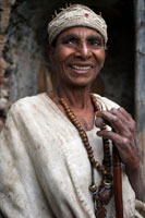 A woman poses next to Birgida Maryam Monastery in one of the islands of Lake Tana. Located in the west of the country and more than two thousand square kilometers, Tana is the largest lake in Ethiopia and a sacred place since time immemorial. Bushy islands stand in the distance, green upholstered to the peaks, forests conceal some of the most important monasteries and churches of the Ethiopian rite, many with more than seven hundred years old.