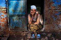 Portrait on the outside of one of the oldest houses in the city of Gondar. In the Amhara region in Ethiopia, Gondar city is famous for its medieval castles and churches that were built by the emperors between 1635 and 1855 years. Until the sixteenth century, the Emperors of Ethiopia lived a nomadic life, moving from place to place within the territory that reigned, with his family, courtiers and royal guards, were set up in tents with the consequent problem that caused rains.