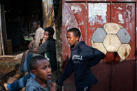 Children play soccer outside Gondar. Gondar became so cultural and economic importance, the capital of the kingdom of Ethiopia until the late nineteenth century, when the power of the emperors began to decay, and was burned on several occasions. . Their peculiar story originated when an emperor of Ethiopia, called Alam Sagaz, aka Fasilidas in 1632 built the first castle in a village next to Lake Tana and Simen Mountains, tired of the nomadic life, and to rest during the rainy season.