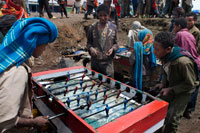 Debark Market. Several children play football while their parents are selling or buying. The town of Debark is the starting point to the Simien mountains one of the wonders of Etiopia.Aqui gather to buy and sell their products, the market is the heart of the town, the center of this small World.In this shirts are made with sewing machines that was your grandmother sold species, clothes, shoes, wool and a myriad of things but it is a world of scent and color.