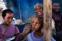 Some of the guests at a birth in the village of Hausein, lack of Gheralta mountains. The parties in these cases are usually numerous and often includes the whole people. The injera and home brew usually present. Basically you eat a dish called injera. It serves in a large plate of about 40-50 cm, usually aluminum, and where a base placed across the surface of 3mm or 5mm in thickness approximately bread-like and very, very fluffy.