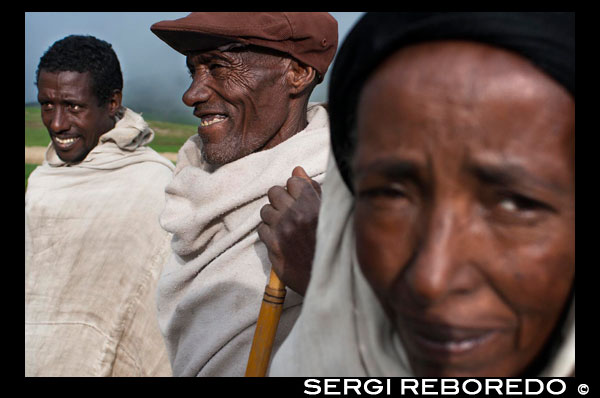 Portrait of a family of Ethiopians on the stretch of road between Gashena Dilb and leading from Mekele to Lalibela. Lalibela is a town in the heart of Ethiopia which is one of the most important religious centers of Ethiopian Christianity for centuries and is a busy place of pilgrimage. Lalibela lies in her womb an architectural treasure that has been classified by UNESCO as World Heritage: an exceptional set of monolithic cave churches and buildings, carved, not built-in bedrock during the Middle Ages, with the purpose of create a new Jerusalem in Africa. These churches are not archaeological fossils but vibrant institutions that keep alive the cult until today. About the visit may attend religious ceremonies in the ambience of the past, and meet some of the strange peculiarities of Ethiopian Orthodox Christianity, the largest number of followers in the eastern independent churches.