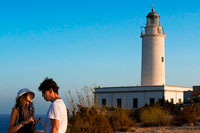 Formentera. Sunset. Young couple tourists in the Lighthouse, Faro de la Mola, Formentera, Pityuses, Balearic Islands, Spain, Europe