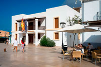 Formentera. Tourists, Town hall in main square of Sant Francesc Xavier, San Francisco Javier, Formentera, Pityuses, Balearic Islands, Spain, Europe.  