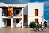 Formentera. Tourists, Town hall in main square of Sant Francesc Xavier, San Francisco Javier, Formentera, Pityuses, Balearic Islands, Spain, Europe.  